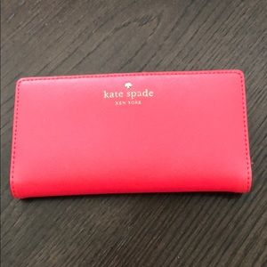 Pink wallet with polka dot lining